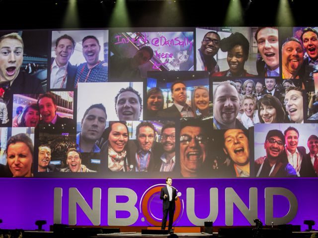 executive on stage during hubspot inbound conference