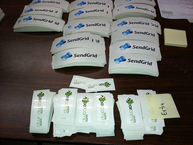Business cards lay out on a table -- from SendGrid and BarCamp