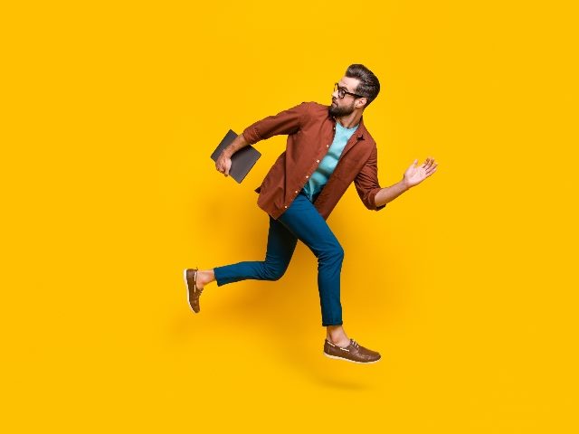 Man running while looking behind.