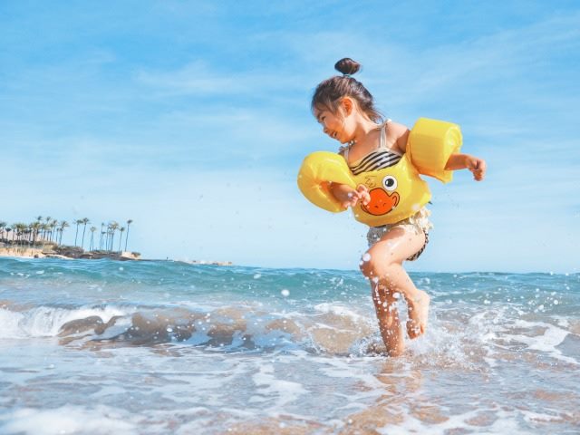 little girl at the beach on vacation