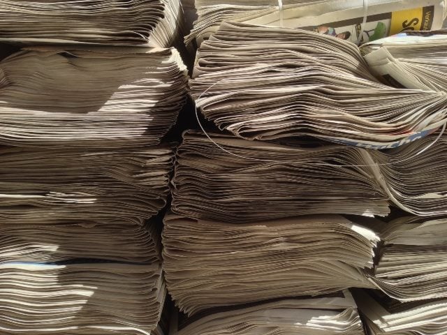 Stack of newspapers.