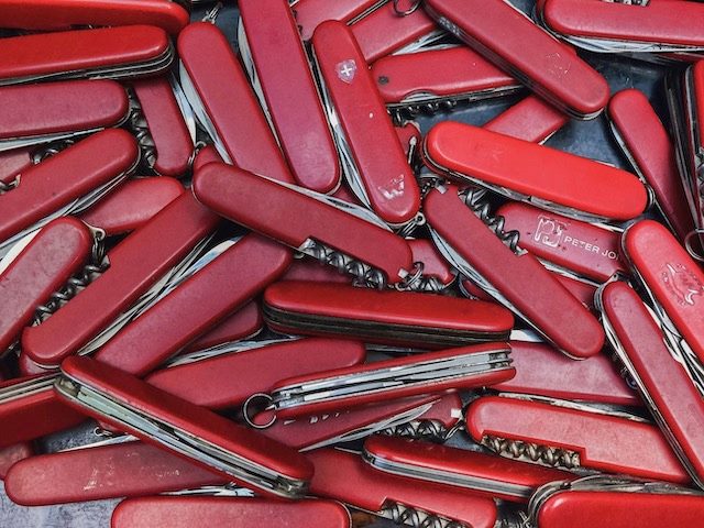 pile of swiss army knives