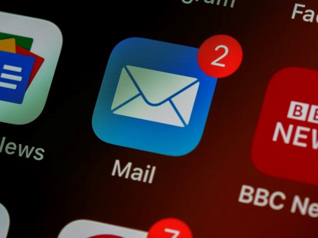 blue email icon on smartphone with notification of two messages