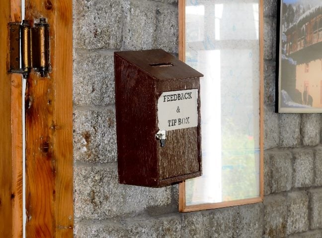 Wooden suggestion or customer feedback complaint box on wall. 