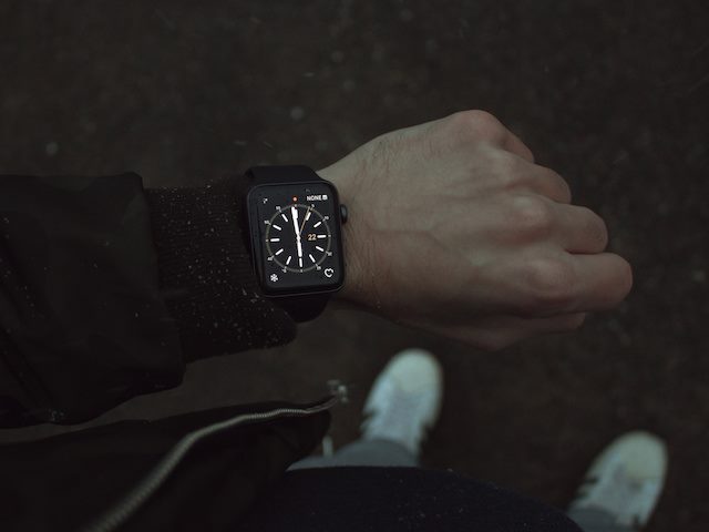 person looking at a smartwatch