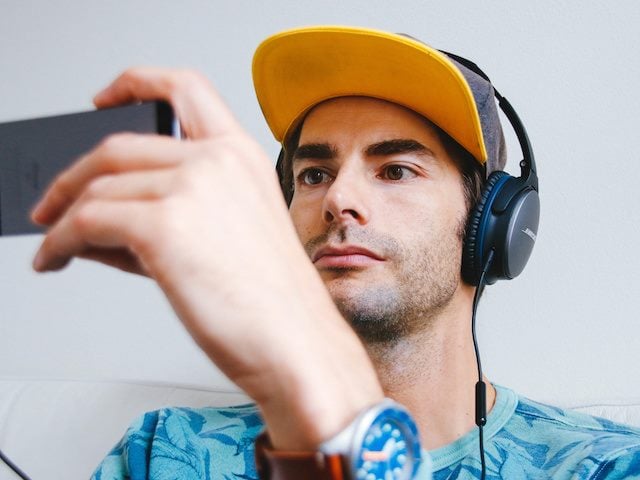 man watching video on his phone