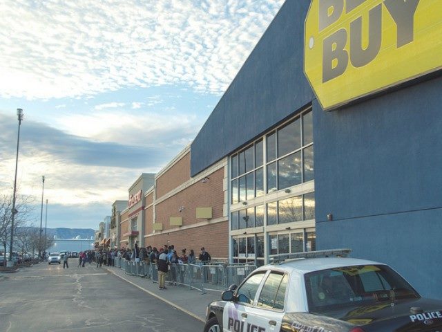 Scene of people in line outside of a Best Buy on a Black Friday shopping day.