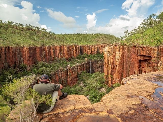 Landscape photographer photographing the iconic cliffs and high plateau of the Cockburn Range, El Questro Station, Kimberley, Australia.