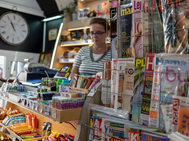In Belgrade, Serbia, a magazine stand and seller in a tobacco shop.