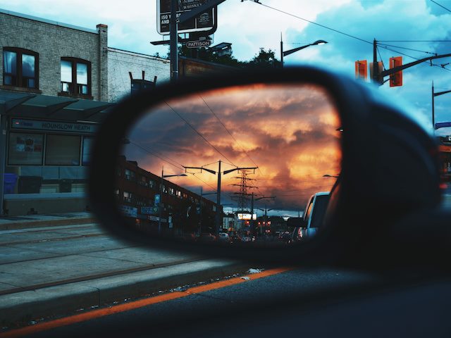 sunset as viewed in a rearview mirror