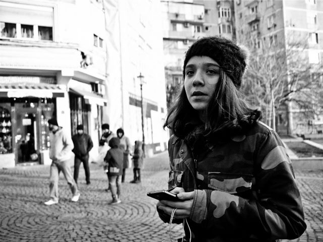 looking lost, holding a phone