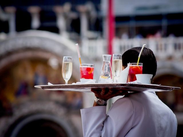 waiter with a tray of drinks