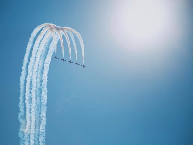five planes flying in unison