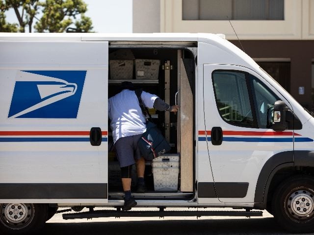 Male service worker delivering mail