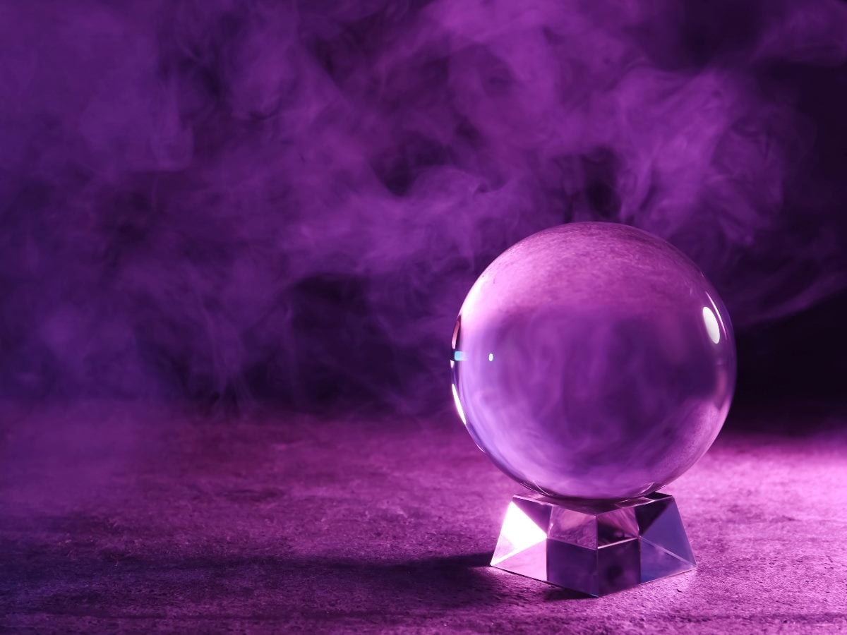 Purple crystal ball surrounded by swirling smoke, symbolizing prediction and uncertainty in data-driven forecasting.