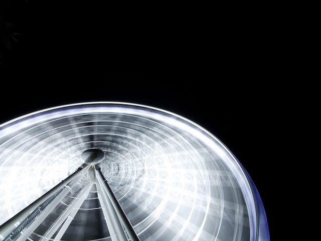 time lapse photo of a ferris wheel in motion