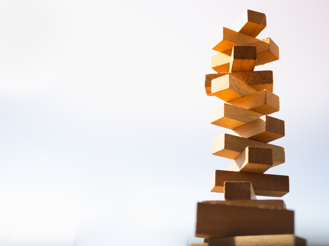 Blocks stacked tall into the sky