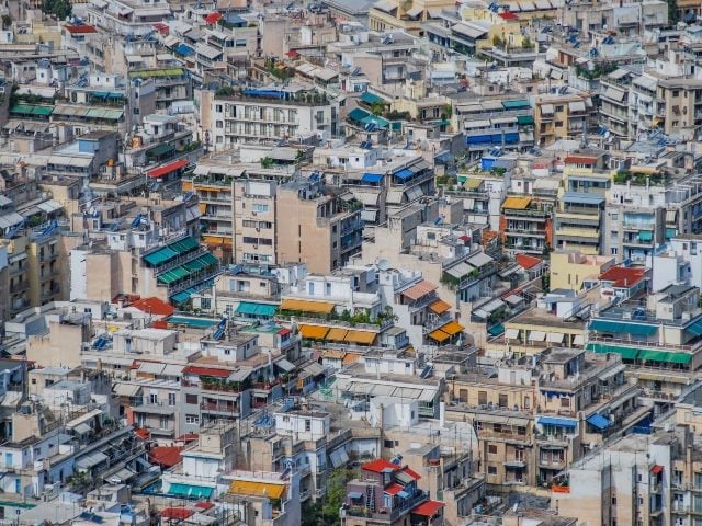 Urban sprawl in Athens, Greece, with colorful buildings piled close together, symbolizing martech sprawl. 