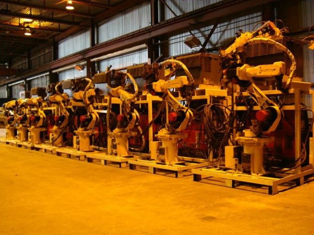 Kitmondo process and packaging machinery lined up in a row.