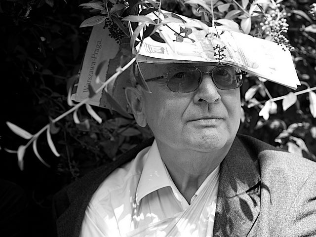 Man wearing newspaper on his head