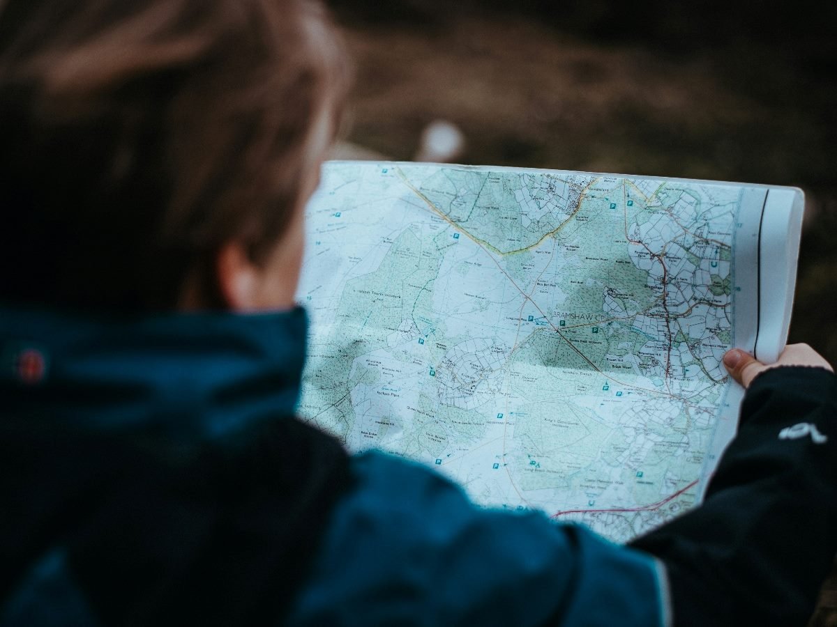 Shot from behind a person holding a map.