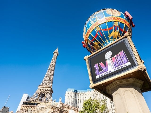A colorful Super Bowl 2024  ad  visible in the cityscape and buildings of Las Vegas in piece about time series analysis of big tent marketing events. 