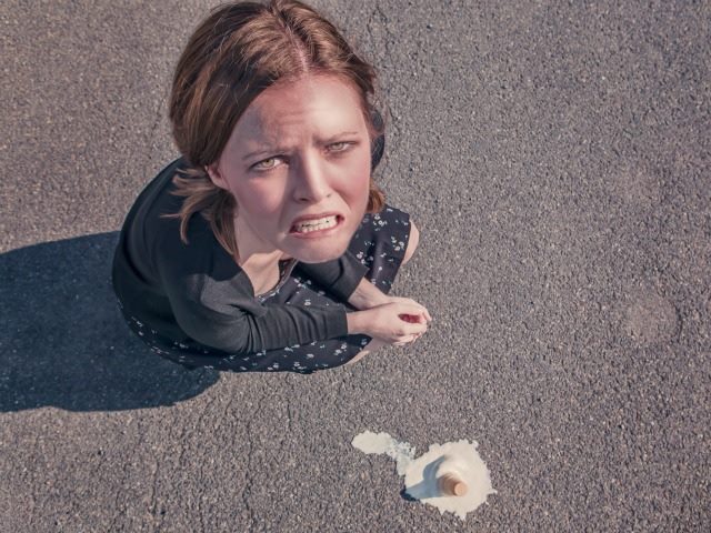 woman with a dropped ice cream cone