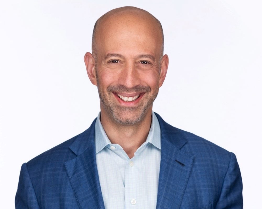 Headshot of Sitecore CEO Eric Stine.