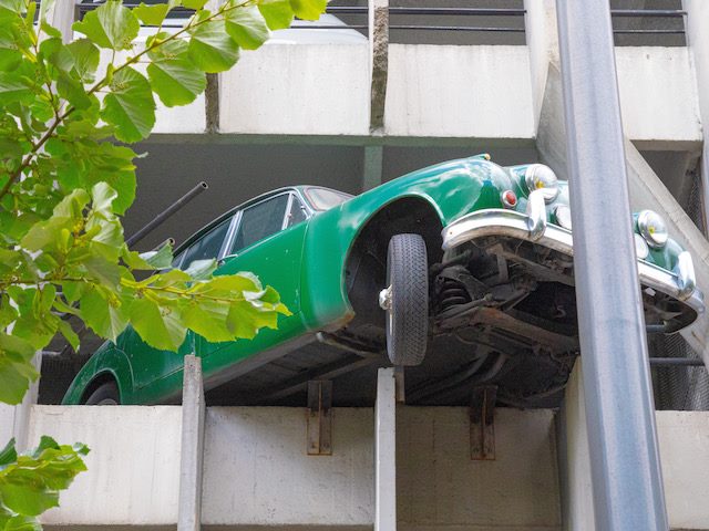 car overshooting a parking garage 
