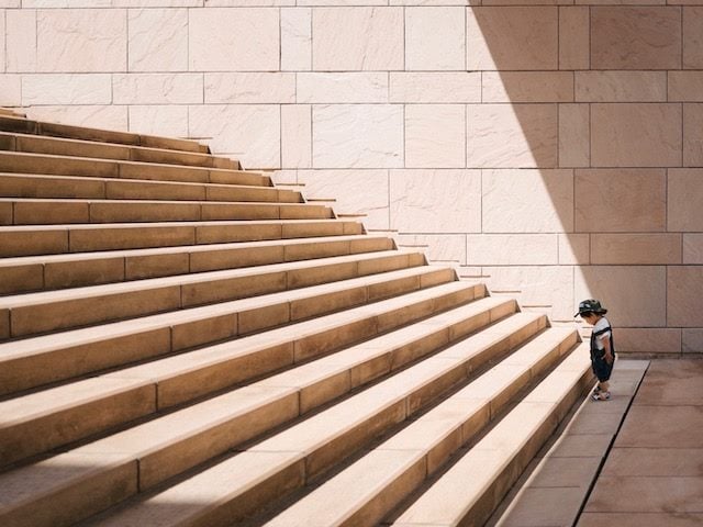 child looking at stairs