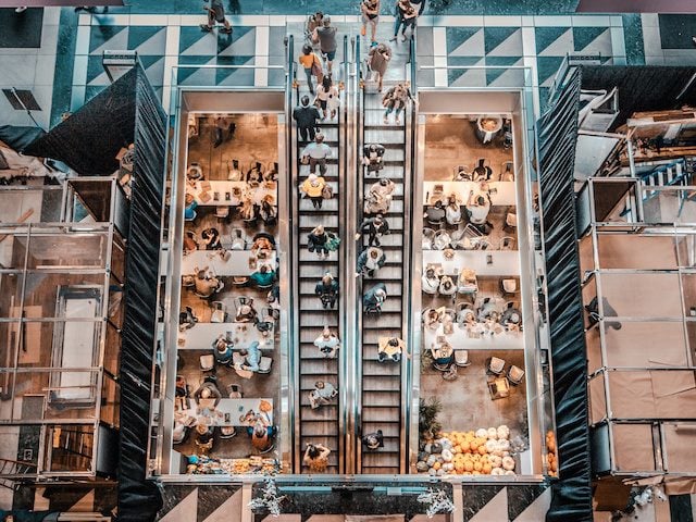 crowded stairwell from above in a shopping mall