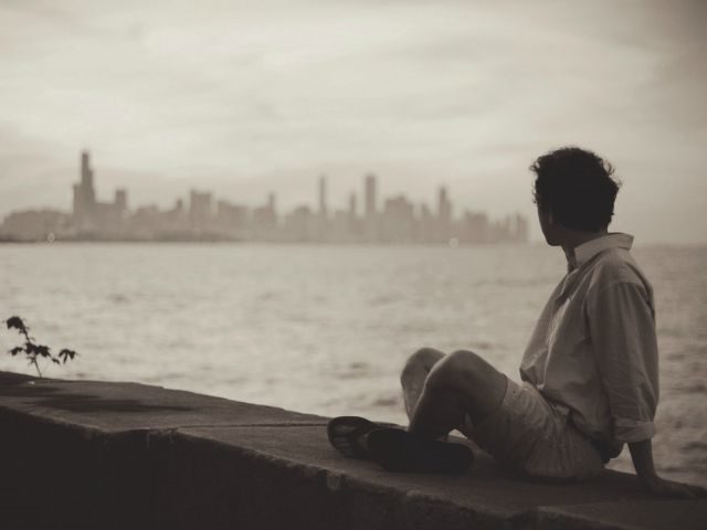 man looking out over the water