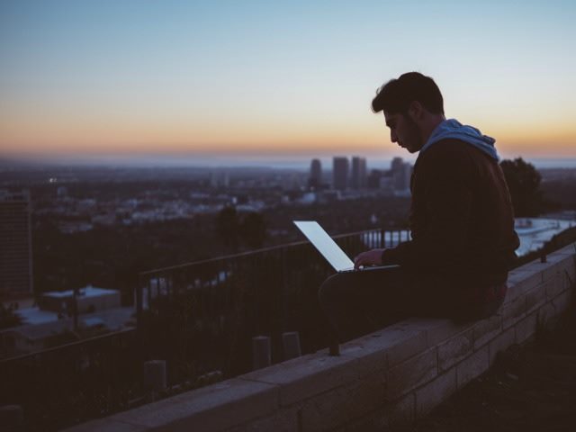 working on computer outside