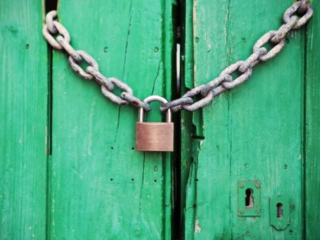 A lock on a wooden door