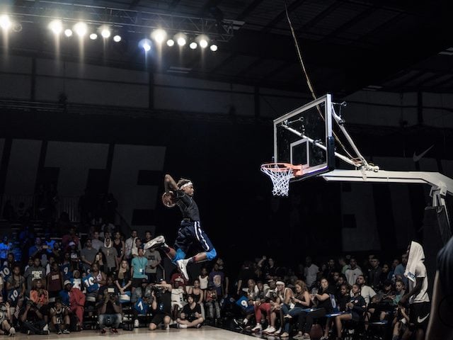 airborne basketball player taking a shot
