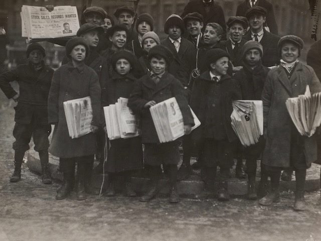 photograph from 1917 of the Boston Globe "Newsies" — young newspaper boys  selling the paper