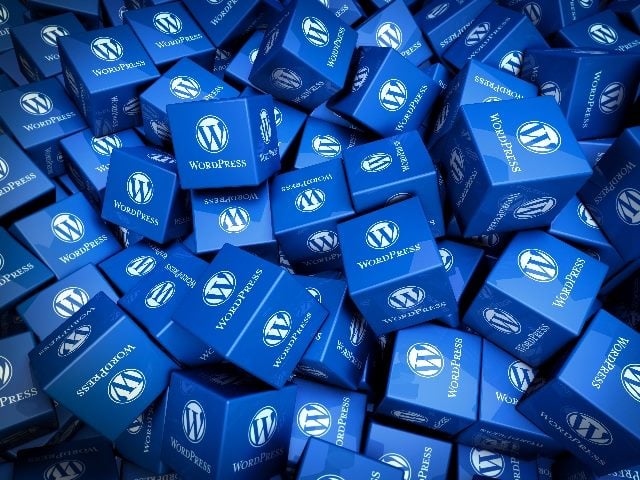 WordPress company logo/swag in the form of dozens of dice-like squares stacked alongside one another. 