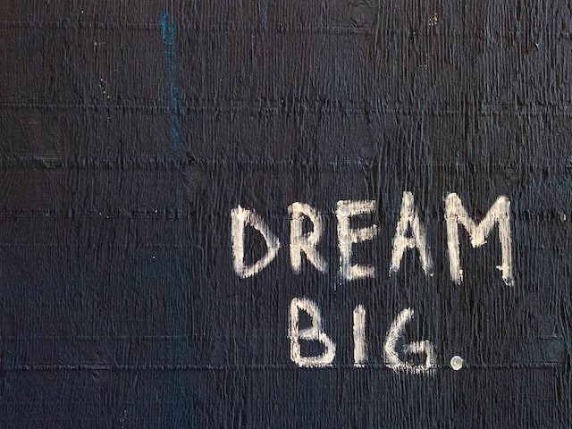 handwritten text: "dream big."
