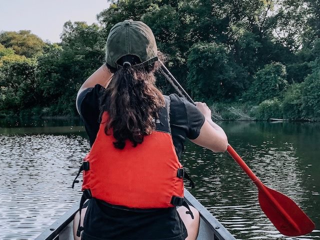 woman paddling a canoe