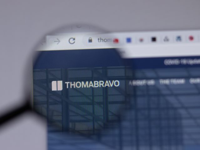 magnifying glass hovers over the words "thomabravo" on a computer screen.