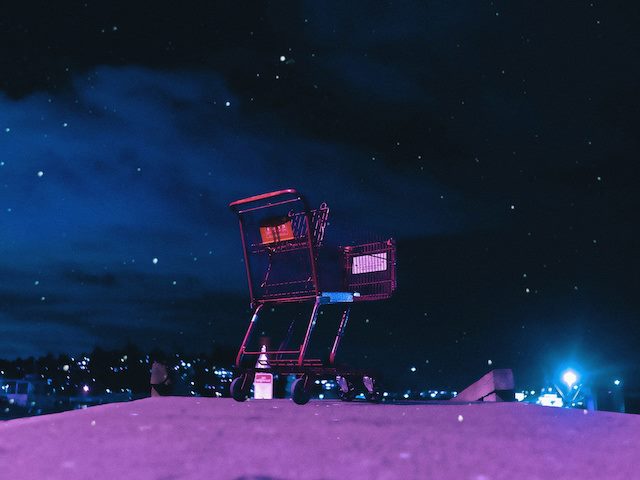 shopping cart at top of hill looking down over Seattle