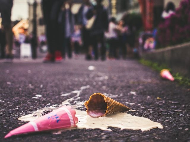 dropped ice cream cone melting on the street