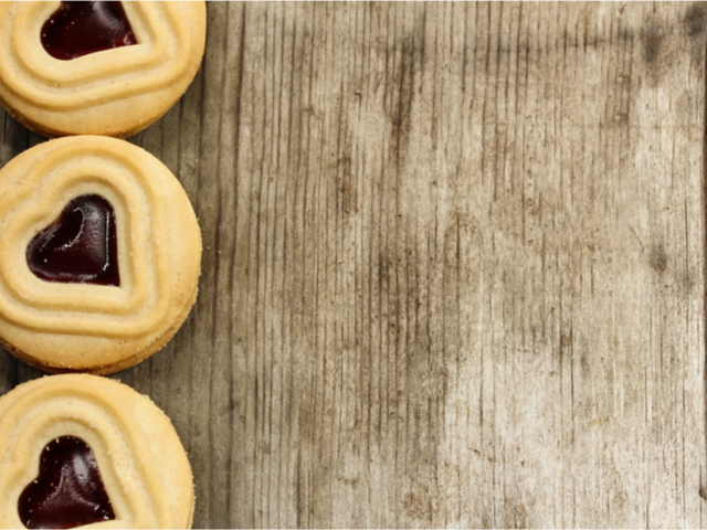 Shortbread cookies lined up on a wooden picnic table - Cookie consent concept