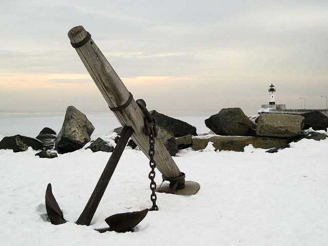 rusty anchor in the snow