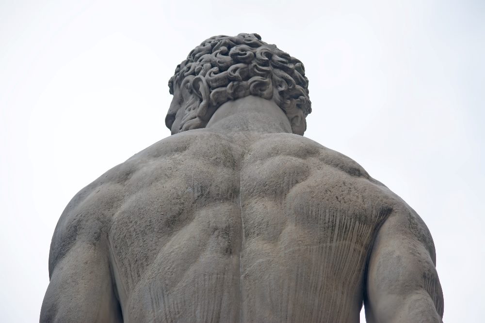 Hercules statue seen from behind with Hercules' broad shoulders and musculature visible in piece about AI trends.