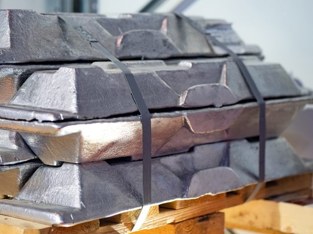 Bars of aluminum stacked up for mining and processing.