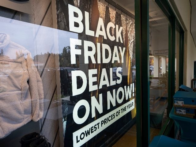 Black Friday deals advertising is seen at the storefront of the Columbia Sportswear Factory Store in Lake Oswego, Oregon. 