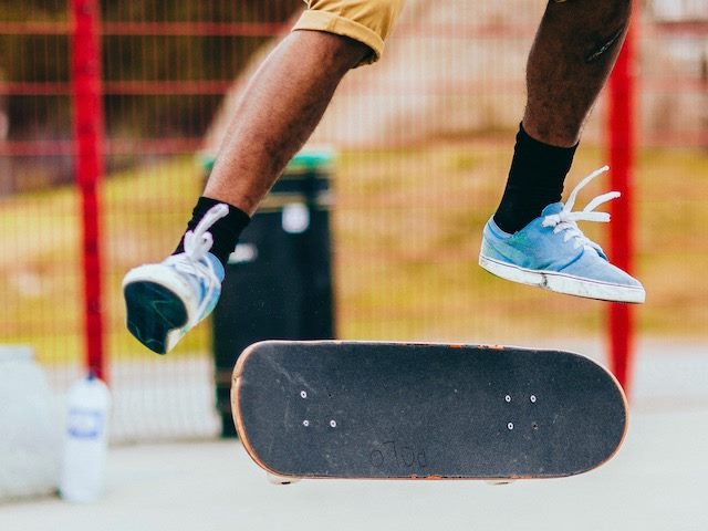 guy doing a flip with his skateboard