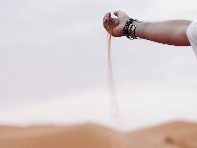sand slipping through a hand