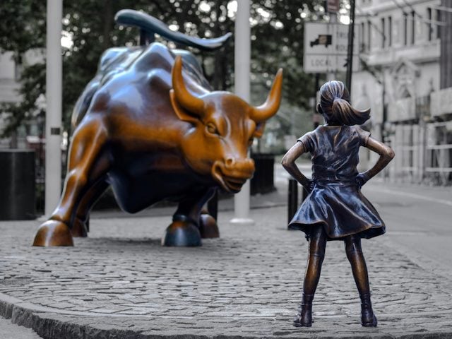 fearless girl facing off the wall street bull
